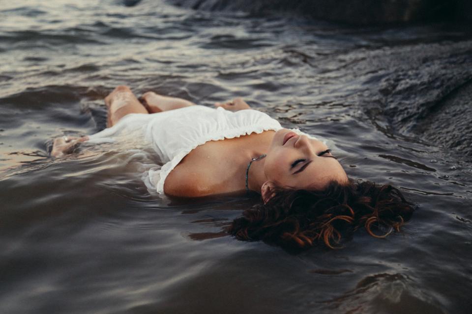 woman doing a relaxing float on water